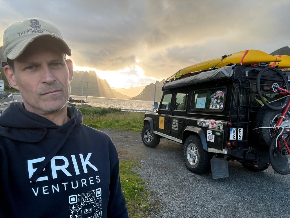 Erik standing beside The Beast on the Lofoten coast.